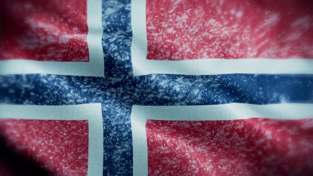 4K blizzard / snow over Norway flag stock video. Frosty Norwegian flag. Whirling / swirling ice crystals. Snowflakes flitting over Norway flag.