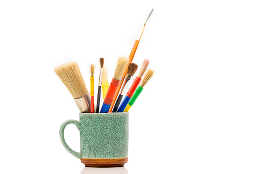 High quality stock studio photos of multi-colored brushes on a white background.