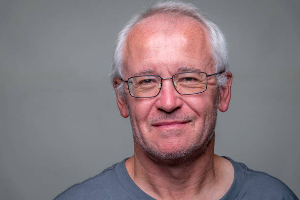 istock Smiling mature senior caucasian man looking at the camera 1428454715