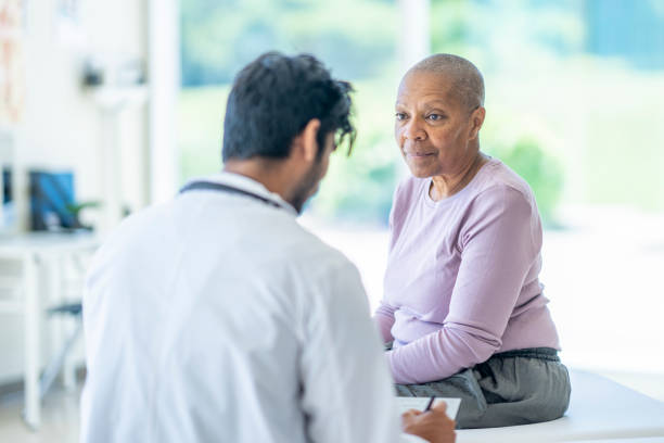 istock Senior Reviewing Tests with the Oncologist 1428458019