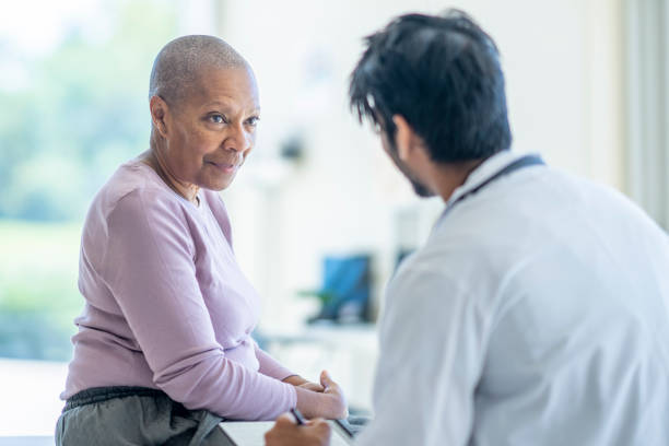 istock Senior Reviewing Tests with the Oncologist 1428458025