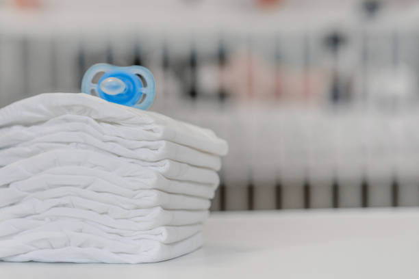 istock A pacifier and diapers. Baby Kit 1428458386
