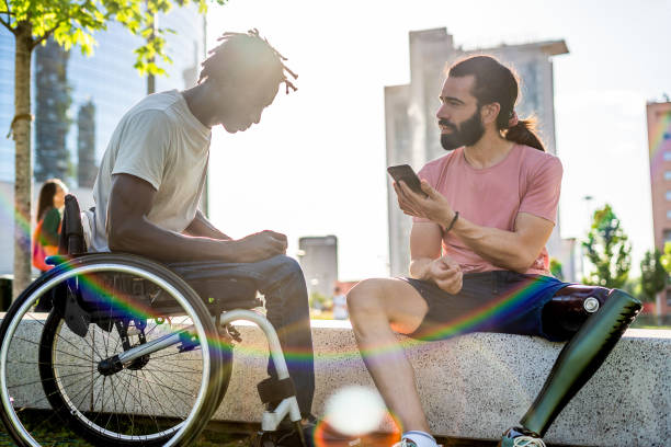 istock Multiethnic guys with disability meeting first time and having conversation through a online translator 1428474631