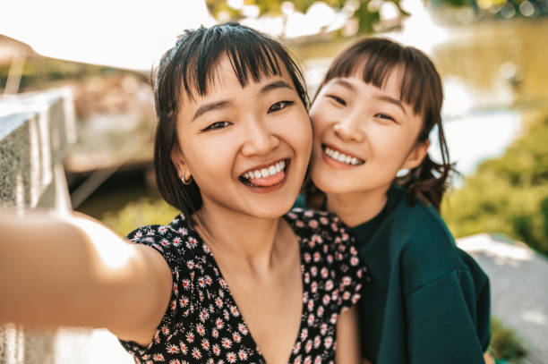 istock Smiling girls making selfie and looking happy 1428477665