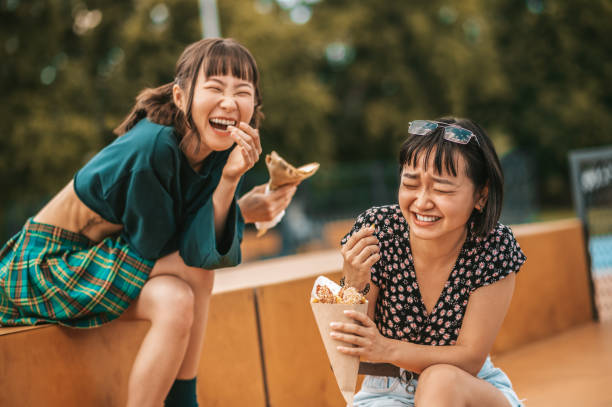 istock Two pretty girls spending time together and looking happy 1428478237
