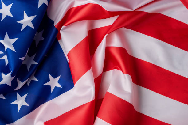 istock United States flag wavy background 1428480124