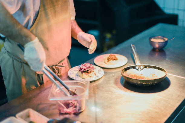 istock Junior chef preparing food ingredients for Chefs final touch 1428484024