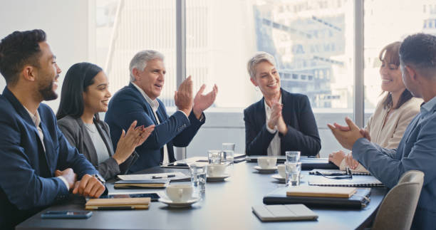istock Applause, success and motivation with a team clapping in celebration for a colleague on her achievement or deal. Teamwork, collaboration and goal with a crowd cheering and saying wow in support 1428484065