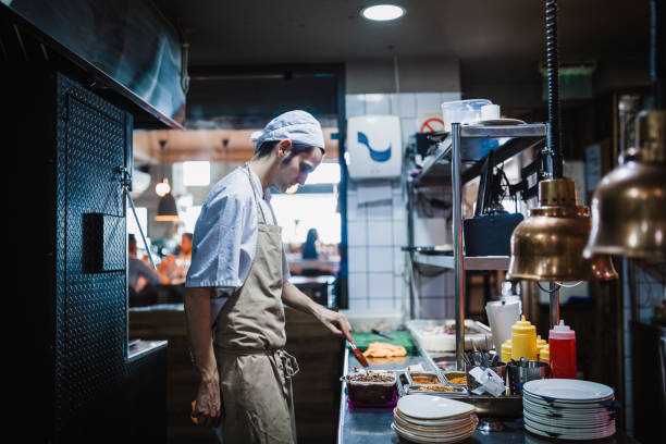 istock Junior chef preparing food ingredients for Chefs final touch 1428484159