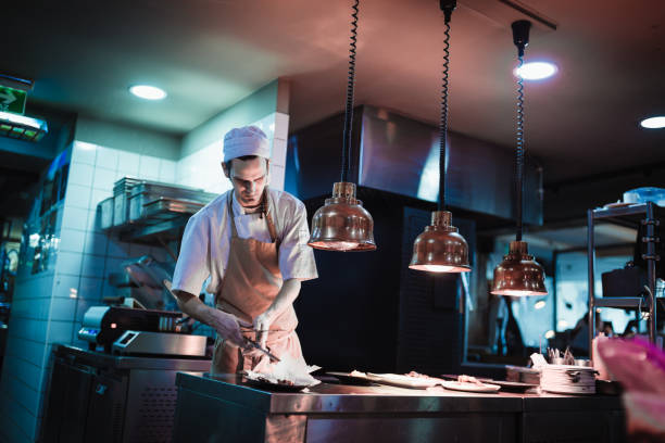 istock Junior chef preparing food ingredients for Chefs final touch 1428484225