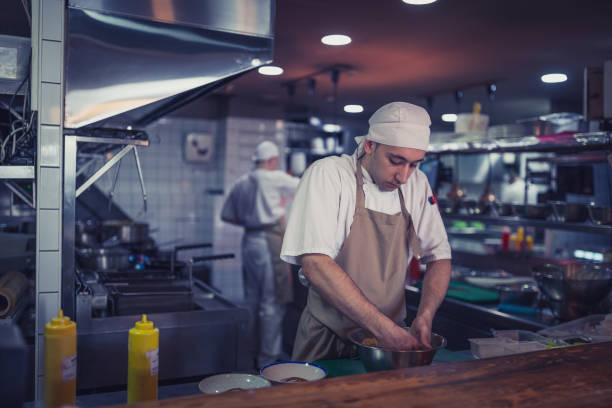 istock Junior chef preparing food ingredients for Chefs final touch 1428485348