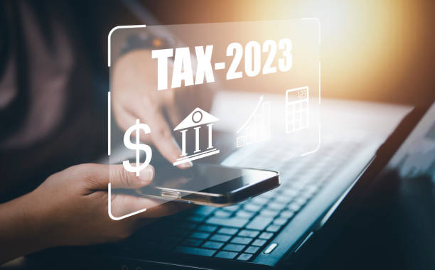 Concept TAX-2023 and refund tax of duty taxation business, graphs, and chart being demonstrated on the screen media, App for selecting tax refund, Keeping track of annual tax expenditures stock photo