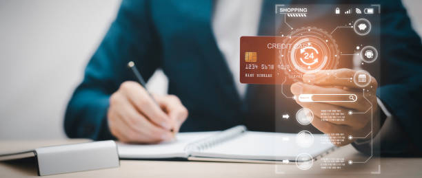 Man holding credit card for makes a purchase on the Internet on the laptop computer with credit card, online payment, shopping online, e-commerce, internet banking, spending money concept.