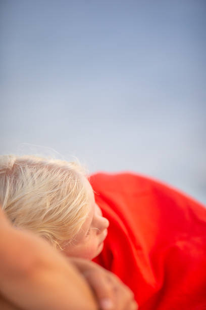 Only One Young Girl with Poppies. Grass in Background. Poland.