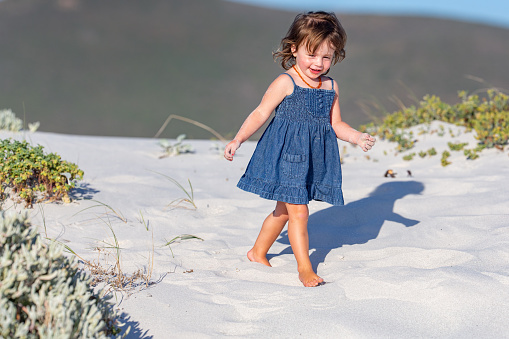 Little girl exploring Western Cape province beach dunes
