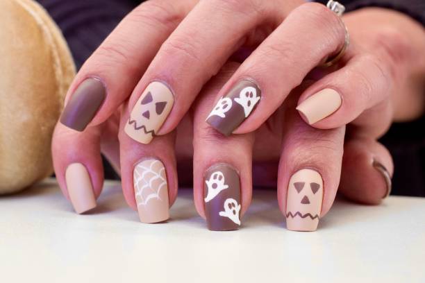 Pumpkin and Ghost Halloween Nail Art Design Halloween Inspired Art yellow nail polish stock pictures, royalty-free photos & images