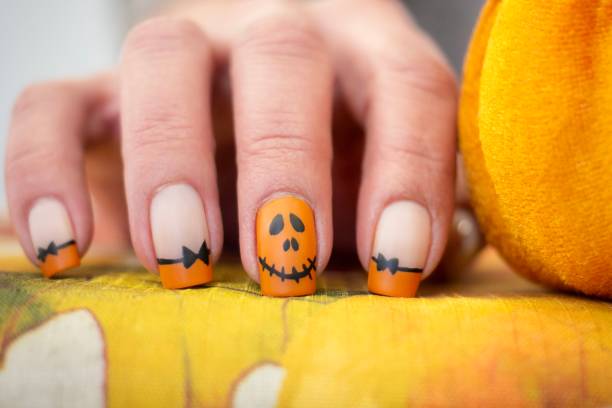 Pumpkin Halloween Nail Art Design Halloween Inspired Art yellow nail polish stock pictures, royalty-free photos & images