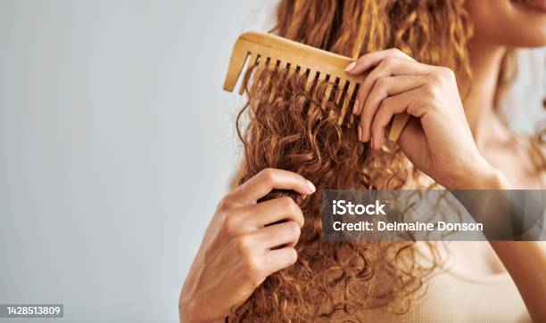 Cleaning Beauty And Hair Care By Woman Brush And Style Her Natural Curly Hair In Bathroom In Her Home Hygiene Frizz And Damage Control With Female Hands Comb Natural Hair In Morning Routine Stock Photo - Download Image Now
