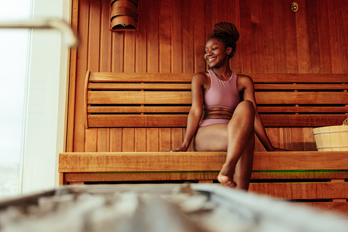 African American woman enjoying sauna