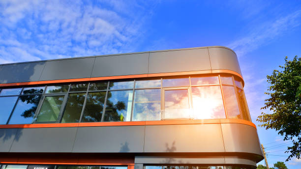 istock Fresh green trees and office building, business concept. 1428516152