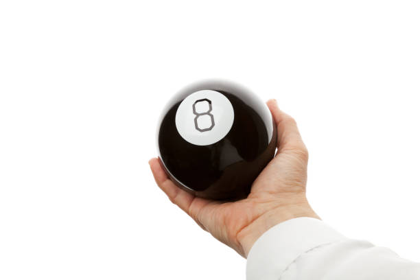 istock Male hand holds black glossy plastic ball number 8 1428525774