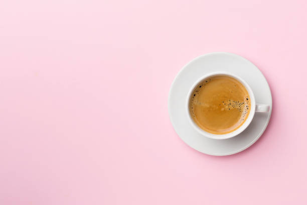 istock Cup of delicious coffee on color background, top view 1428529473