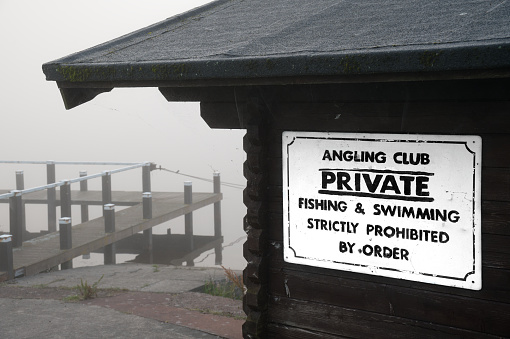 Private fishing and swimming sign at lake in Kilmacolm UK