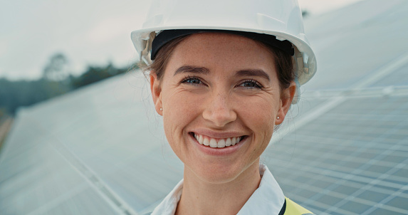 Building, architect manager and woman engineer on a engineering and architecture job site. Portrait of a young management leader feeling proud with industrial work success with a safety hard hat