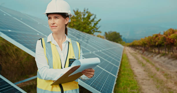 istock Sustainability, solar panel building engineer and woman check green electricity data and information. Futuristic architecture project of a agriculture energy management lead working on eco design 1428532225