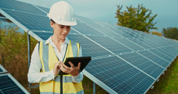 istock Solar energy and electricity with a woman engineer, technician or contractor working on a tablet to install panels on a farm outside. Renewable, innovation and sustainability with a female outdoor 1428532231