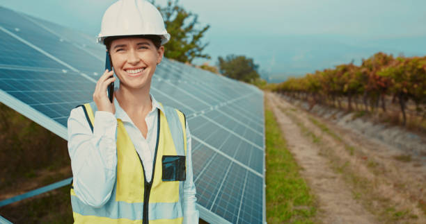 istock Solar panel, renewable energy and construction worker happy with phone call, working in industrial field and 5g communication building photovoltaic plant. Engineer talking and tech doing maintenance 1428532235
