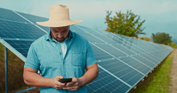 istock Sustainability, phone solar panel planning and farmer check online data. Agriculture, future and green farming of a worker using technology for eco electricity and clean energy growth design 1428532240