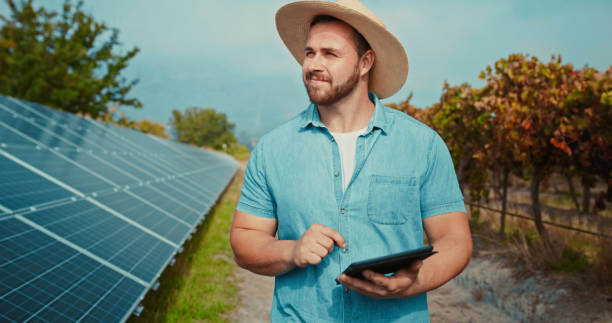 Man, tablet or solar energy farm engineer thinking or planning future renewable goal, sustainability sun grid or electricity power. Smile, happy or innovation farmer with biodegradable industry plant