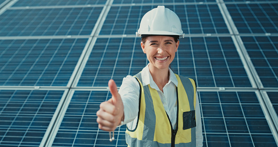 Solar panels, thumbs up, and engineer portrait with like hand emoji, success or trust in power saving electricity. Electrician woman with yes, good job or support finger sign icon for carbon capture