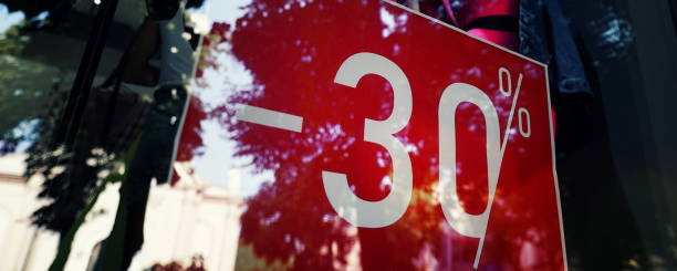 istock Red sign 30 percentage discount fixed behind window case glass 1428532696