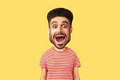 Caricature comic portrait of surprised funny man looking with open mouth and amazed big eyes.