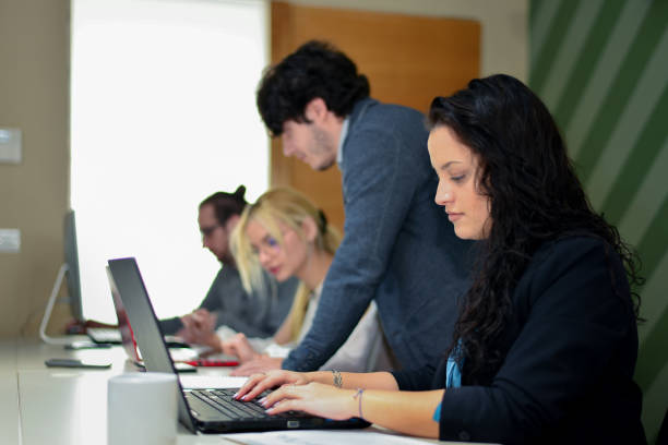 istock A team of creative professionals looking at the lap top and brainstorming ideas. 1428535146