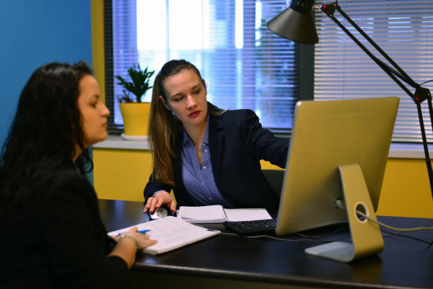 istock Banker discusses banking services to new customer. 1428535160