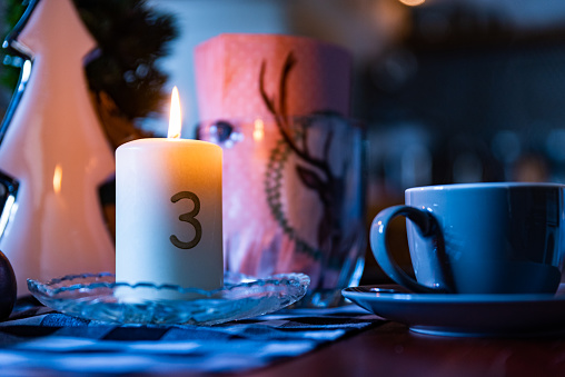 Christmas candles on rustic wooden table