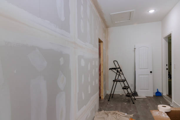 istock Finishing plastering drywall is ready for paint with newly constructed house under construction 1428544453
