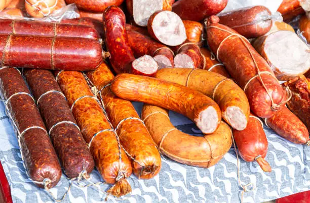 Selling smoked homemade meat and sausage at the farmers market