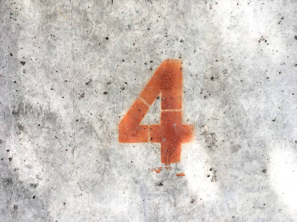 istock Red number four on dld dirt stains concrete wall texture background  and copy space 1428553540