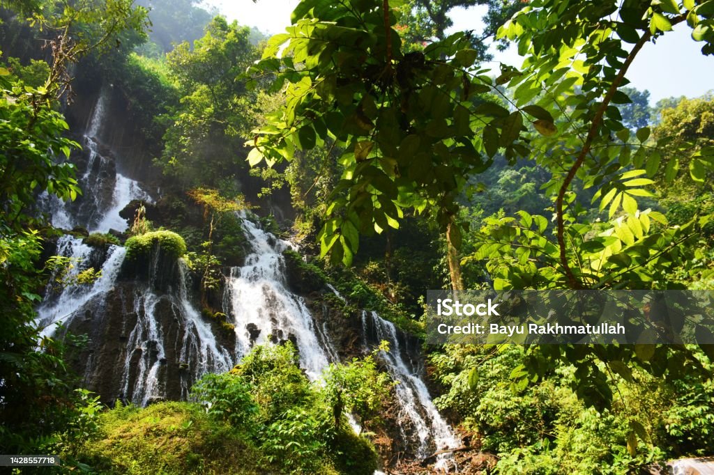 Telaga Biru Waterfall Beautiful waterfall in Lumajang, East Java. Awe Stock Photo