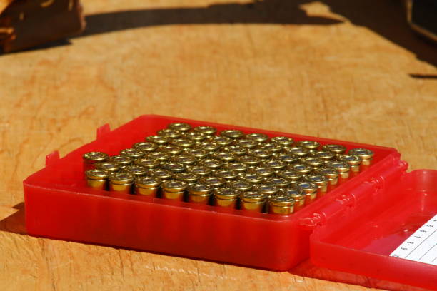 istock Rows of ammunition cartridges lines up in a red plastic container 1428558490