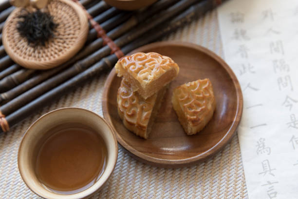 Mid-autumn festival, slice of moon cake, tea break, tea set, Chinese tea culture stock photo