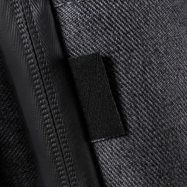 istock Blank black clothing label on black color fabric texture 1428560970