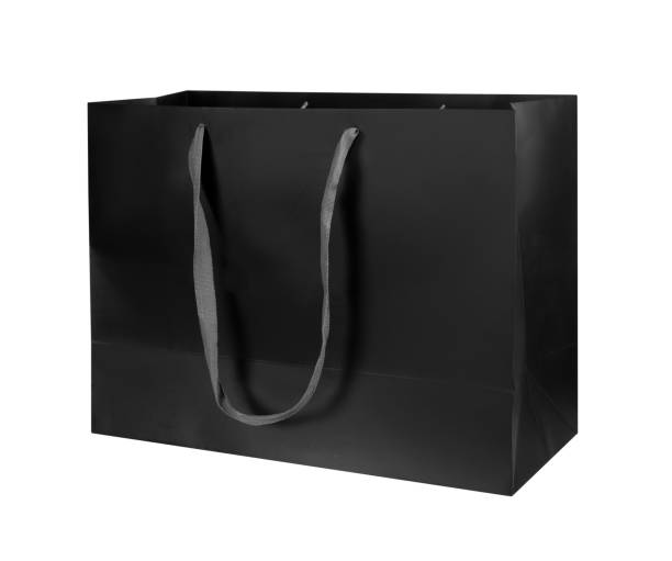 istock Black color paper shopping bag isolated on white 1428561813