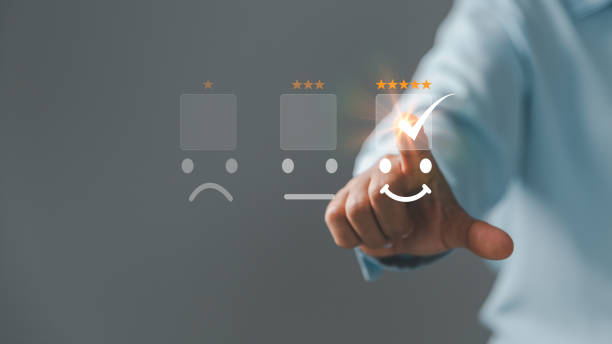 istock Customer service and Satisfaction concept, Excellent consumer feedback. Business people are touching virtual screen on happy Smiley face icon to give satisfaction in service. rating very impressed. 1428562096