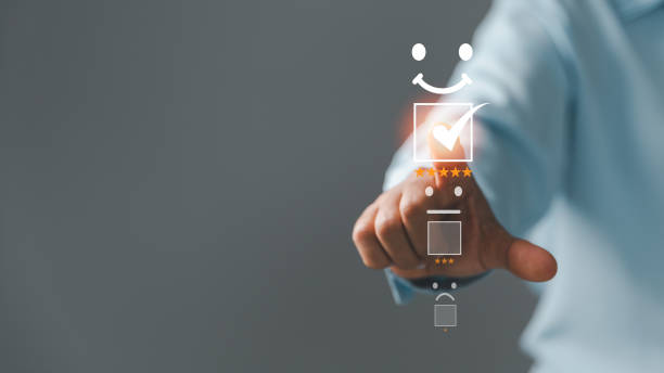 istock Customer service and Satisfaction concept, Excellent consumer feedback. Business people are touching virtual screen on happy Smiley face icon to give satisfaction in service. rating very impressed. 1428562209