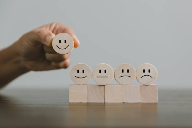 istock Satisfaction survey concept. Customer services best excellent business rating experience. Hand of business chooses a smile face on wood block circle. 5 Star Satisfaction. People feel great product. 1428562225